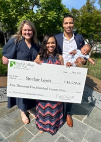 Newborn Sweepstakes Winners holding check